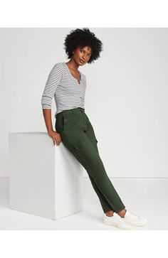 We've done it again: Made another pair of must-have chinos. With a mid rise they're perfectly polished and incredibly comfortable. Plus we've added extra pockets to carry even more. And the slim fit is a flattering choice every time, pairing perfectly with anything oversized, fitted or anything in-between. Crisp twill with a hint of stretch Button & zip fly, plus belt loops Mid rise hits just below natural waist Front and back welt pockets; cargo pockets with button closure Slim leg fits clo Cozy Womens Sweaters, Flannel Dress, In Between, Chino Pants, Fall Jackets, Slim Leg, Slim Legs, Chinos Pants, Lands End