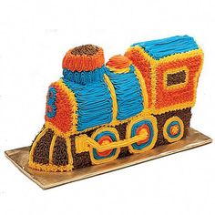 a cake shaped like a train on top of a table