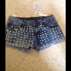 Studded Shorts Fitted Denim Rock Bottoms, Rock Style Fitted Denim Bottoms, Fitted Rock Style Denim Bottoms, Fitted Rock Style Bottoms For Summer, High Waist Rock Bottoms For Spring, High Waist Rock Style Summer Bottoms, High Waist Rock Style Bottoms For Spring, Spring Rock Style High Waist Bottoms, Stretch Denim Jean Shorts For Night Out