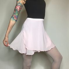 "Our original ballet wrap skirt, Classical Wraps are slightly longer in the back. They are made with a high quality, semi-translucent chiffon that is light weight with beautiful drape. The 5/8\" elasticized ribbon holds the skirt in place while you petite your way across the floor. For details on sizing & length, scroll down to the \"Sizing Information\" link." Fitted Asymmetrical Tennis Skirt For Summer, Fitted Ruffled Flared Skort, Fitted Solid Color Hip-length Skirt, Fitted Asymmetrical Tennis Skirt For Spring, Elegant Fitted Tennis Skirt For Spring, Feminine Fitted Tiered Mini Skirt, Fitted Solid Color Tiered Mini Skirt, Fitted Mini Tennis Skirt With Ruffles, Elegant Asymmetrical Skort