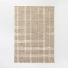 a beige and white checkered fabric on a white background