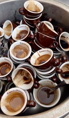 many cups of coffee sit in a bowl