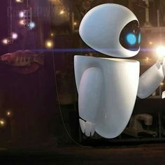 a white robot holding a light up in front of a window with fish on it