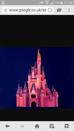 an image of a pink castle in the dark