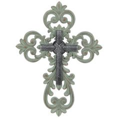 an ornate metal cross with filigrees and scrolls