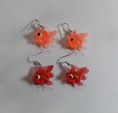 Handmade with rubber/plastic & hypoallergenic metal. You Choose Light Orange or Dark Orange Style: Hook/Dangle Fish charms measures: approx. 3/4" long x 3/4" Be sure to check out my other listings for the matching necklace charm! Fish Earrings, Fish Bag Earrings, Gold Fish Earrings, Handmade Fish-shaped Earrings For Gifts, Goldfish Earring, Fish Hoop Earrings, Silly Earrings, Orange Fashion, Light Orange