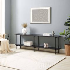 a living room with blue walls and a white rug