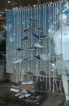 a display window with shoes and suitcases in it