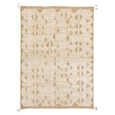 a beige and white rug with an arrow pattern on the front, fringe trimming around the edges