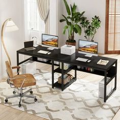 a computer desk with two computers on it