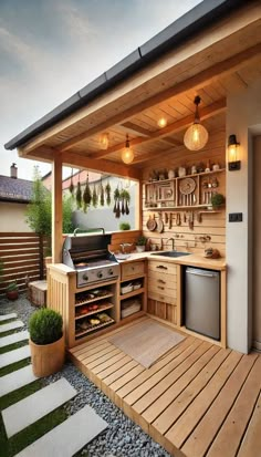 an outdoor kitchen with wood flooring and wooden cabinets, built into the side of a house