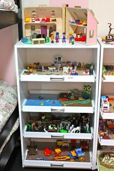 two shelves filled with legos on top of each other