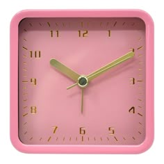 a pink square clock with gold hands and numbers