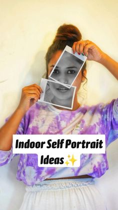 a woman holding up an image with the words indoor self portrait ideas above her head