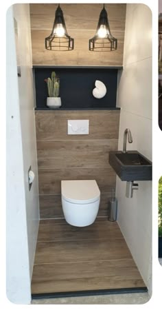 a bathroom with a toilet, sink and wooden paneling on the wall behind it