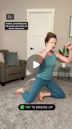 a woman is sitting on the floor doing yoga