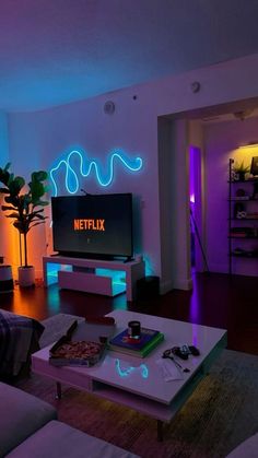 a living room filled with furniture and neon lights