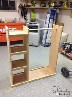 a mirror sitting on top of a wooden shelf