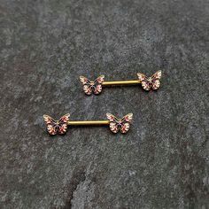 14 Gauge 5/8 Gold Tone Pink Blue Red Butterfly Barbell Nipple Ring Set - Surgical Grade Stainless Steel - Body Candy Butterfly Tongue Piercing, Pink Internally Threaded Piercings As Gift, Nip Piercings Barbell, Nip Piercings Barbell Hello Kitty, Nip Piercings Rings, Nip Piercings Barbell Heart, Piercing Rings, Pink Backgrounds, Pregnancy Belly Rings