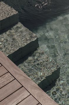 the water is crystal clear and there are steps leading up to it