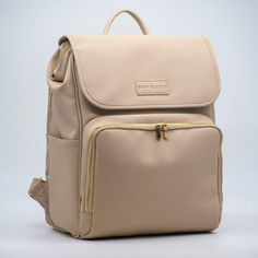 a beige backpack with zippers on the front and side, sitting against a white background