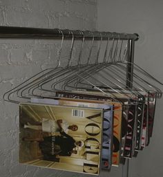 a magazine rack with magazines hanging from it