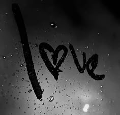 the word love written in black and white raindrops