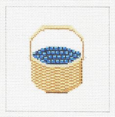 a basket with blue and white fabric in it on a white background, the image is made from cross stitch