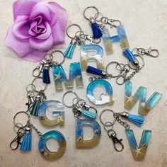 the letters are made out of glass and have charms attached to each letter that spell out love