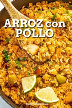 a skillet filled with rice and olives next to a wooden spoon that says arroz con pollo