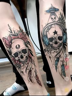 two people with tattoos on their legs, one has headphones and the other has a skull