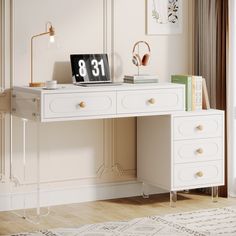 a white desk with a clock on top of it