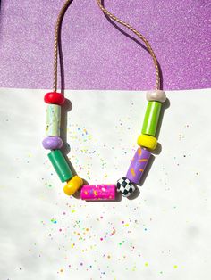 ✿ Bold & unique wearable art Utopic Color Charm Necklace ✿ Made with various shaping techniques ✿ Multicolored & textured handcrafted beads ✿ One of a kind design. Each necklace is distinct from the next ✿ Extremely durable leather cord ✿ Worldwide international shipping Whether you're planning to go to a concert, a festival, a birthday party, a night out with friends, the beach, or the supermarket, delicately handcrafted Utopic Color Charm Necklace adds a unique touch to your outfit! Go To A Concert, Night Out With Friends, Handmade Beaded Jewelry, Out With Friends, Leather Cord, Festival Fashion, Beaded Necklaces, Wearable Art, Gift Registry