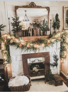 a fireplace decorated for christmas with garland and lights