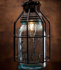 a mason jar hanging from a ceiling light