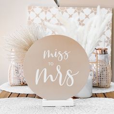 a sign that says miss to mrs on it next to some other decorations and items