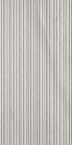 a white wall with vertical lines painted on the side and in grey tones, as well as an area for text