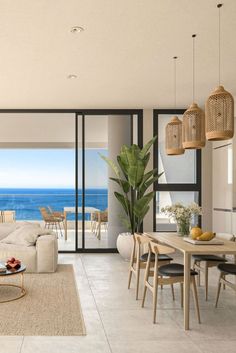 a living room filled with furniture and an ocean view