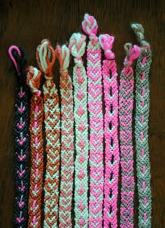 several different colored braids are lined up on a table