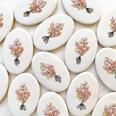 many decorated cookies with flowers on them