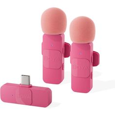 two pink microphones sitting next to each other