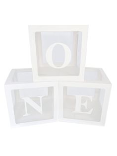 three white blocks with the letters o and e on them