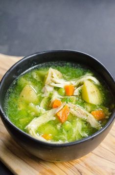 a bowl of chicken soup on a cutting board with the words instant pot peruvian chicken soup