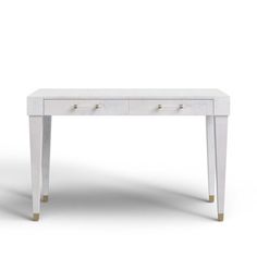 a white table with two drawers and gold handles on the bottom, against a white background