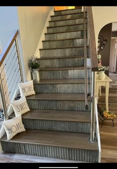 the stairs in this house are decorated with decorative signs and pillows that read home sweet home