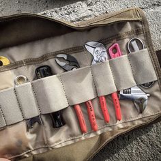 the contents of a tool belt are neatly organized