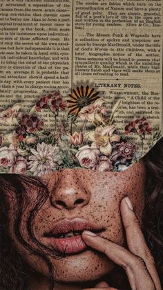 a woman's face with flowers on her head and an open book in the background