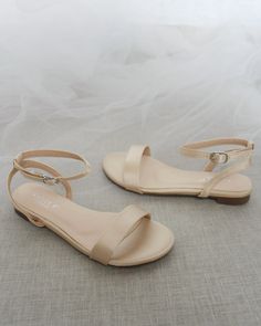 Classy satin flat sandals with ankle strap. Effortless yet adorable to wear on your favorite occasion. Can be pair with dress or casual look.DETAILS:COLORS AVAILABLE: Ivory, White, Pink, Light Blue, and ChampagneUPPER: Synthetic upper and liningMATERIALS: Mandmade outsoleSTYLE NAME: MADDY Champagne Shoes Wedding, Prom Flats, Bridesmaid Shoes Flat, Bridesmaid Flats, Bridesmaid Sandals, Nude Flats, Dressy Sandals, Girls Flats, Nude Sandals