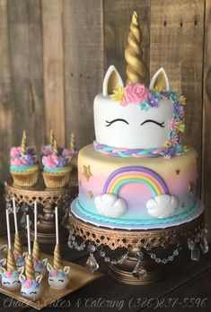 an image of a unicorn cake with cupcakes