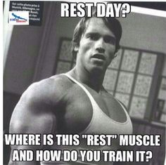 a man is posing for the camera in front of a poster with words that say rest day? where is this rest muscle and how do you train it?